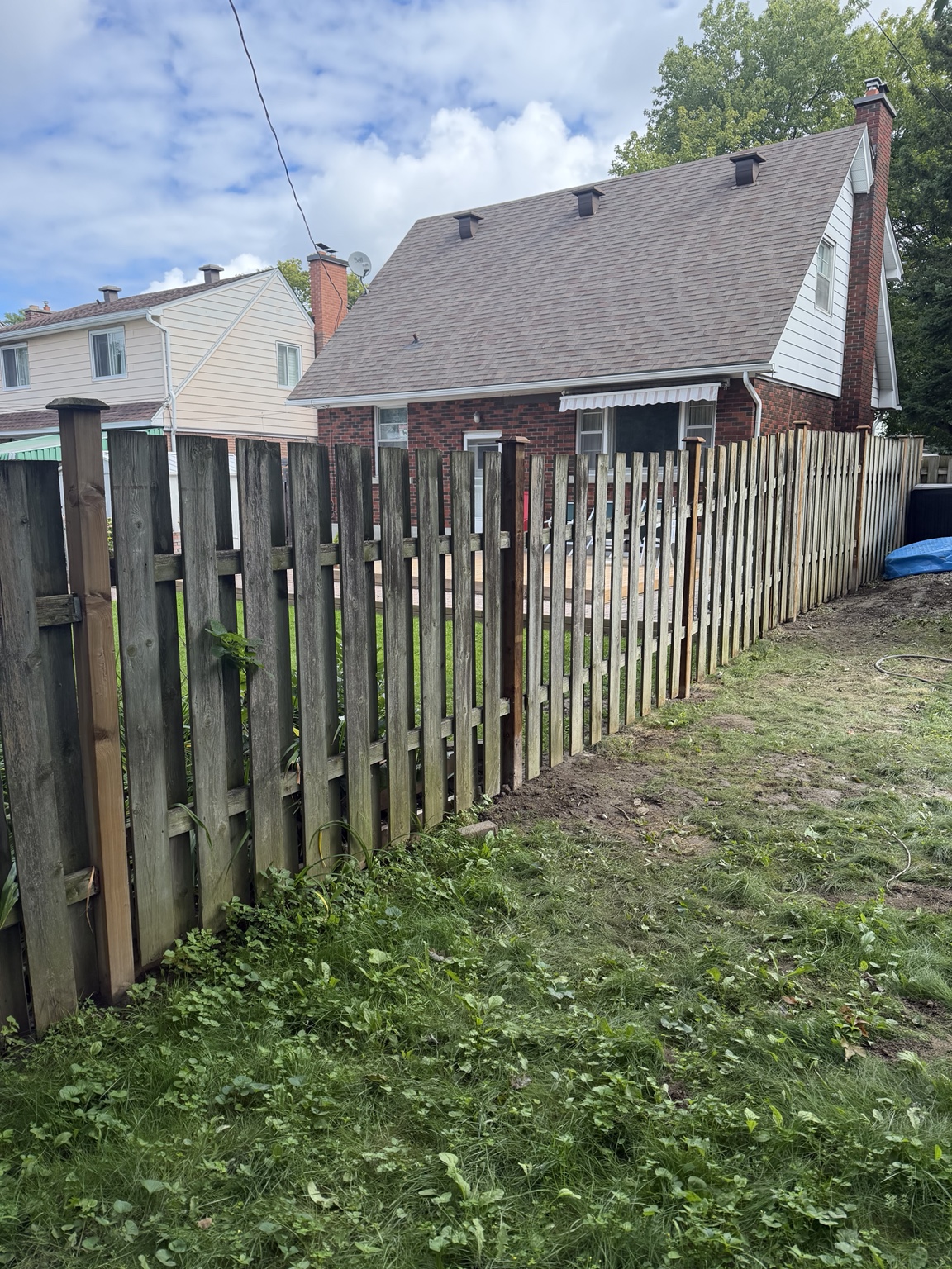 Wood privacy fence installed along a residential yard